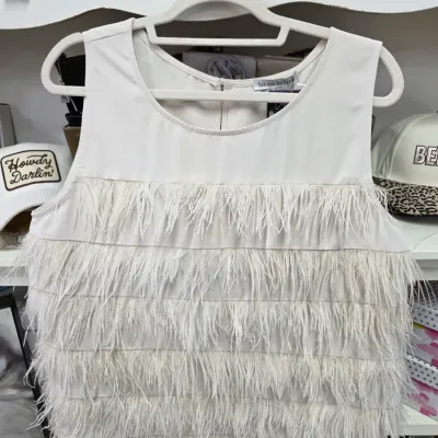 Sale Photo Thumbnail #369: Off-white sleeveless top by See and Be Seen featuring tiered feather fringe details on the lower half, displayed on a hanger.