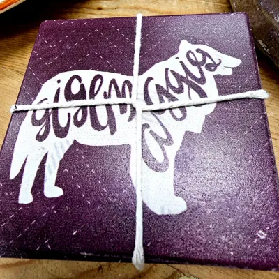 Sale Photo Thumbnail #452: Set of Texas A&M Aggies themed stone drink coasters tied with string.
