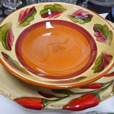 Sale Photo Thumbnail #472: Hand-painted ceramic serving bowl and matching large platter featuring vibrant red chili pepper motifs.