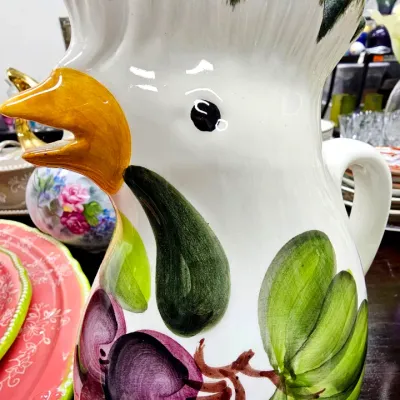Sale Photo Thumbnail #476: Vintage ceramic rooster pitcher with hand-painted grape motifs and a glossy finish.
