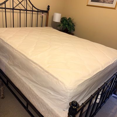 Sale Photo Thumbnail #17: Black metal and wood full-size bed frame featuring geometric headboard and footboard detailing, complete with mattress and box spring.