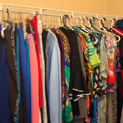 Sale Photo Thumbnail #20: Closet full of women's plus size gently owned clothing on hangers featuring a variety of tops, dresses, and sweaters in colorful patterns and solids.
