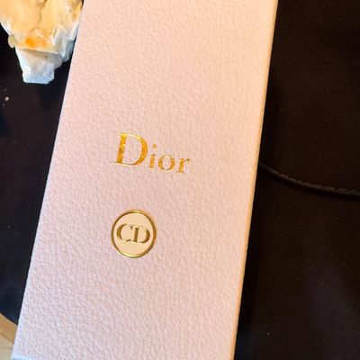 Sale Photo Thumbnail #34: Light pink textured Christian Dior presentation box with gold foil logo and CD emblem.