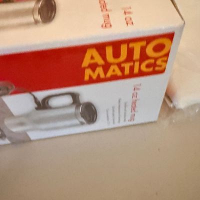 Sale Photo Thumbnail #49: Vintage Auto Matics 14 oz heated travel mug in its original packaging.