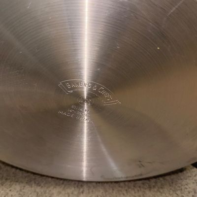 Sale Photo Thumbnail #74: Bottom stamp detail of a 14-inch Bakers & Chefs commercial-grade stainless steel pan, made in the USA.