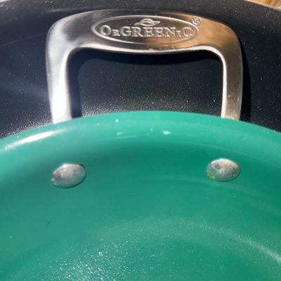 Sale Photo Thumbnail #76: OrGreenic non-stick green ceramic cookware pan with stainless steel handle, showing light wear.