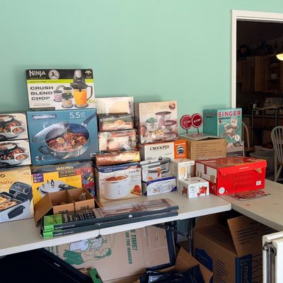 Sale Photo Thumbnail #179: Large collection of boxed kitchen appliances and cookware, including a Ninja food processor, Crock-Pot slow cookers, and Tramontina saute pan.