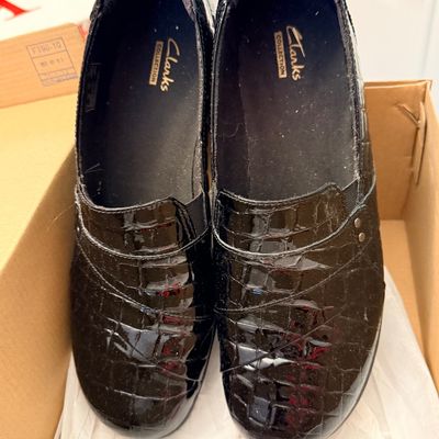 Sale Photo Thumbnail #238: Pair of Clarks Collection women's black patent faux-croc leather slip-on loafers inside their original box.