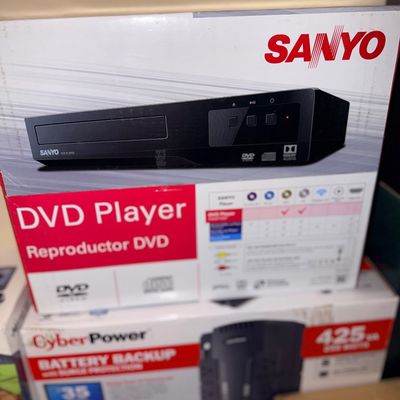 Sale Photo Thumbnail #298: Sanyo DVD player in its original box, displayed above a CyberPower battery backup unit.