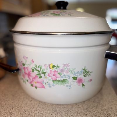 Sale Photo Thumbnail #320: Vintage white enamel stockpot with lid, featuring a pastel pink and green floral pattern, circa 1980s.