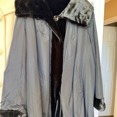 Sale Photo Thumbnail #338: Vintage gray swing coat featuring a plush dark faux fur oversized collar, cuffs, and inner lining, secured with a single decorative front button.