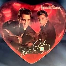 Vintage Russell Stover heart-shaped chocolate tin featuring Elvis Presley graphics and signature replica.