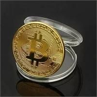 Novelty gold-plated physical Bitcoin commemorative coin, displayed with its clear protective acrylic capsule case.