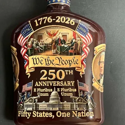 Commemorative ceramic decanter celebrating the 250th anniversary of the United States (1776-2026), featuring patriotic imagery,...