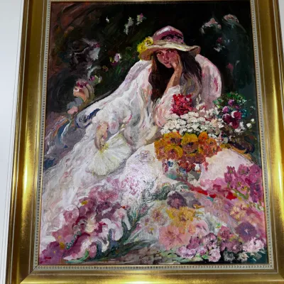 Sale Photo Thumbnail #29: Impressionist-style oil painting depicting a woman in a sunhat seated among vibrant flowers, framed in a ornate gold-finished frame.