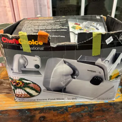Sale Photo Thumbnail #73: Chef'sChoice International Model 645 VariTilt professional electric food slicer in its original, worn box.