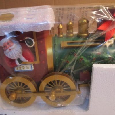 Sale Photo Thumbnail #2: Track is 54" in diameter, train measures 17" long x 4" wide x 6" tall, needs 4 AA batteries not included.  See pictures