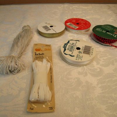 Sale Photo Thumbnail #436: 12' of red bead trim, 5 yds gold ribbon, 80", 2.22 yds Happy Holidays ribbon, 6 yds. White ribbon, 3 yd 1/4" elastic, See pictures