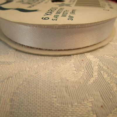 Sale Photo Thumbnail #439: 12' of red bead trim, 5 yds gold ribbon, 80", 2.22 yds Happy Holidays ribbon, 6 yds. White ribbon, 3 yd 1/4" elastic, See pictures