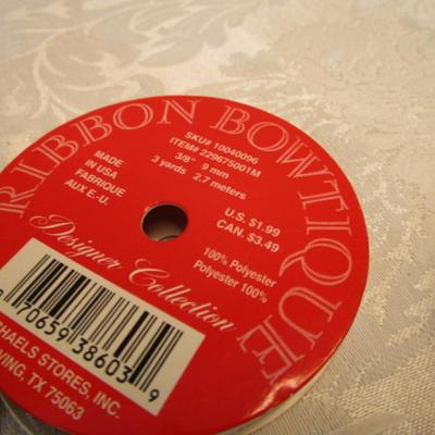 Sale Photo Thumbnail #444: 12' of red bead trim, 5 yds gold ribbon, 80", 2.22 yds Happy Holidays ribbon, 6 yds. White ribbon, 3 yd 1/4" elastic, See pictures