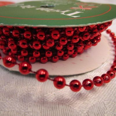 Sale Photo Thumbnail #441: 12' of red bead trim, 5 yds gold ribbon, 80", 2.22 yds Happy Holidays ribbon, 6 yds. White ribbon, 3 yd 1/4" elastic, See pictures