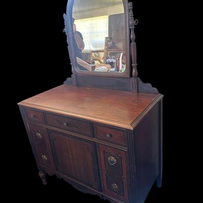 Sale Photo Thumbnail #8: 2) 66 X 40 X 20 Arched tilt mirror  5-drawer configuration with drop-pull hardware  two-tone wood inlay accents  carved scrollwork  and turned legs. 66 X 40 X 20    