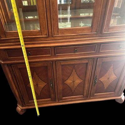 Sale Photo Thumbnail #24: 6) 82"T × 54"W × 19"D 3 glass upper display doors  3 middle pull-out drawers  3 lower cabinet doors featuring diamond sunburst wood marquetry  curved bun feet. Dimensions: 82" H x 54" W x 19" D  