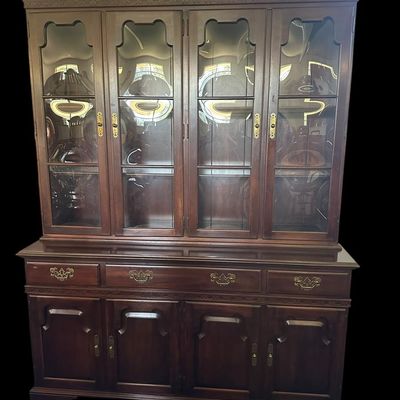 Sale Photo Thumbnail #102: 80 x 20 x 60 Solid mahogany construction featuring four upper cabinet doors with distinct curved/convex glass panes  molded dentil trim  four center drawer storage bays  and four lower raised-panel cabinet doors with brass bail hardware.80 x 20 x 60  