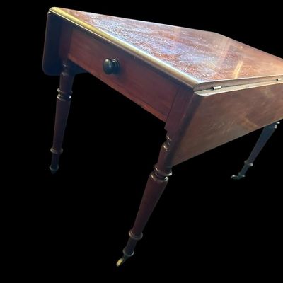Sale Photo Thumbnail #121: 42"W (leaves) / 24"W (no leaves) × 45"L × 29"T Vintage Solid Wood Drop-Leaf Dining Table  features two fold-down end leaves and tapered legs and silverware drawer. Measurements: 42" wide w/leaves  24" w/o leaves  45" length  29" tall. Local  .  