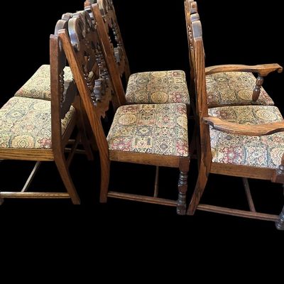 Sale Photo Thumbnail #159: Set of 6 heavy solid oak dining armchairs featuring high carved crown backrests with flower medallion rosettes  turned spindle gallery  curved armrests  stretchered legs  and tapestry woven patterned upholstery.  