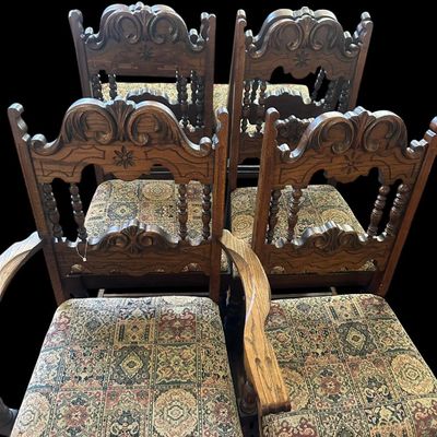 Sale Photo Thumbnail #158: Set of 6 heavy solid oak dining armchairs featuring high carved crown backrests with flower medallion rosettes  turned spindle gallery  curved armrests  stretchered legs  and tapestry woven patterned upholstery.  