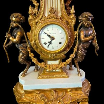 Sale Photo Thumbnail #242:  Antique Gilded Clock and Candelabra Set with Cherub Motif.                           