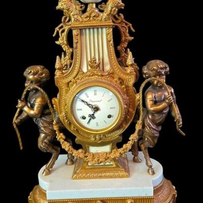 Sale Photo Thumbnail #239:  Antique Gilded Clock and Candelabra Set with Cherub Motif.                           