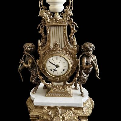 Sale Photo Thumbnail #235:  Antique Gilded Clock and Candelabra Set with Cherub Motif.                           