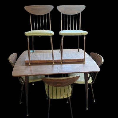 Sale Photo Thumbnail #588: 29.50 Tall 70.50 Long (w/leaves) 46.00 (w/o leaves) 35.50 Wide 11.50 (each leaf) MCM dining set featuring walnut-tone laminate rectangular table with extension leaf and tapered black metal legs with brass ferrule feet  paired with 6 matching chairs featur