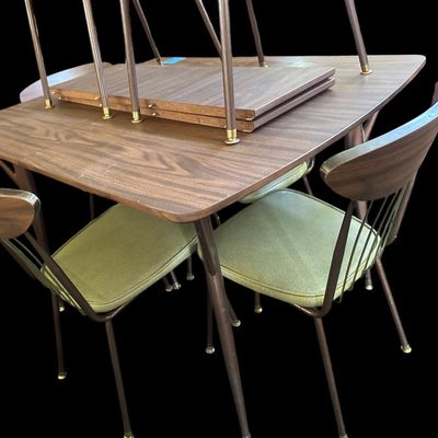 Sale Photo Thumbnail #589: 29.50 Tall 70.50 Long (w/leaves) 46.00 (w/o leaves) 35.50 Wide 11.50 (each leaf) MCM dining set featuring walnut-tone laminate rectangular table with extension leaf and tapered black metal legs with brass ferrule feet  paired with 6 matching chairs featur