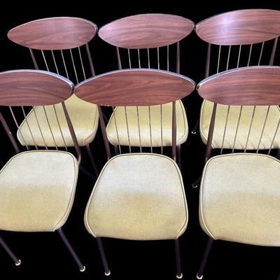 Sale Photo Thumbnail #585: 29.50 Tall 70.50 Long (w/leaves) 46.00 (w/o leaves) 35.50 Wide 11.50 (each leaf) MCM dining set featuring walnut-tone laminate rectangular table with extension leaf and tapered black metal legs with brass ferrule feet  paired with 6 matching chairs featur