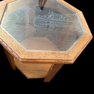 Sale Photo Thumbnail #660: 20 x 22 each Pair of 8-sided solid oak octagonal accent end tables featuring inset etched glass tops—one featuring a flying bald eagle scene and the other featuring a grizzly bear in wilderness—over lower open display shelves. 20 x 22 each.   
