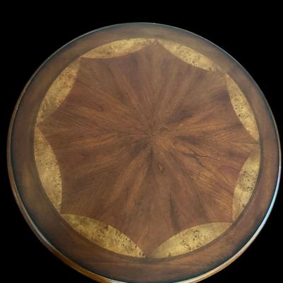 Sale Photo Thumbnail #780: 28.50 Tall 23.00 Round Round accent table featuring an intricate starburst grain wood inlay with burl veneer border top under glass  fluted center pedestal  and tripod splayed base. Dimensions: 36" Round x 17.50" Tall.  