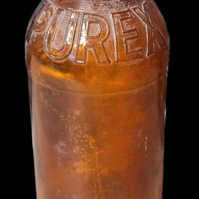 Sale Photo Thumbnail #818:  Purex amber bleach bottle. Owens-Illinois base 15 I 53 — 1953.                           