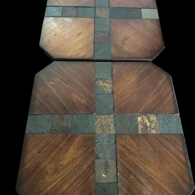 Sale Photo Thumbnail #841: Pair of square accent tables featuring tops set with multi-color natural slate tile cross inserts and parquet wood panels over dark metal X-brace bases and lower wooden display shelves.  
