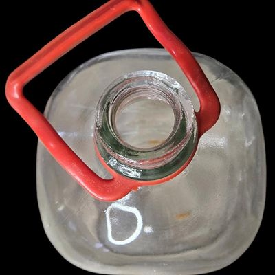 Sale Photo Thumbnail #845:  Large clear utility jug with handle.                           