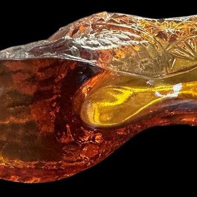 Sale Photo Thumbnail #889:  Amber pressed-glass slipper with cat on the heel. Fenton-style novelty. Check ear for chips.                           