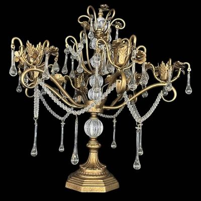 Sale Photo Thumbnail #913: Vintage Hollywood Regency style decorative tabletop centerpiece (epergne style) in an antique gold gilt finish. Features a central fluted glass urn column supporting sweeping scrolled brass arms adorned with dimensional carved brass rose blooms and foliag
