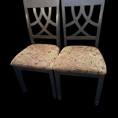 Sale Photo Thumbnail #915: Pair of contemporary side dining chairs with ebony wood frames  intersecting curved backrest splats  and rich woven brown/gold paisley tapestry seat cushions.  