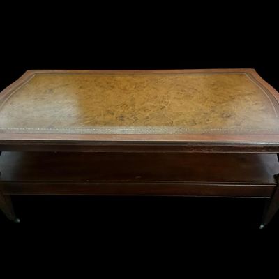Sale Photo Thumbnail #921: 42"L × 21"D × 16.5"T Traditional coffee table featuring gold-tooled leather top inlay  Dimensions: 42" Long x 21" Deep x 16.50" Tall.  