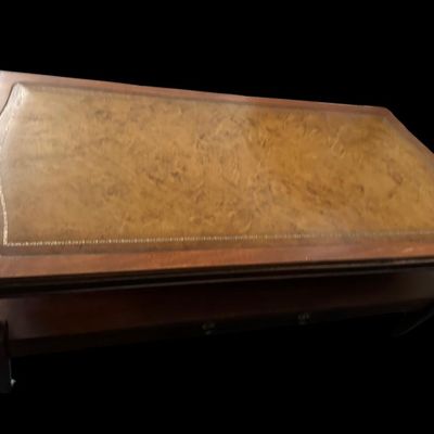 Sale Photo Thumbnail #923: 42"L × 21"D × 16.5"T Traditional coffee table featuring gold-tooled leather top inlay  Dimensions: 42" Long x 21" Deep x 16.50" Tall.  