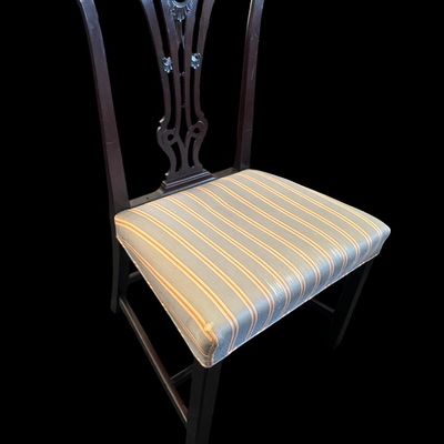 Sale Photo Thumbnail #938: Traditional mahogany accent dining/side chair featuring carved pierced splat backrest with central rosette motif  stretchered square legs  and blue/gold striped fabric seat.  