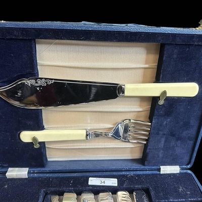 Sale Photo Thumbnail #941:  Vintage Stainless Steel Fish Set With Cream-Colored Handles and Case.                           