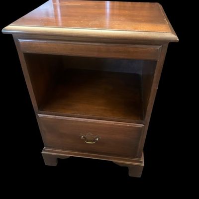 Sale Photo Thumbnail #948: 27.00 x 19 x 14.50 Solid wood end table/nightstand in warm mahogany finish featuring top slide-out tray  open middle display cubby section  lower drawer with brass bail handle  and bracket feet. 27.00 x 19 x 14.50  